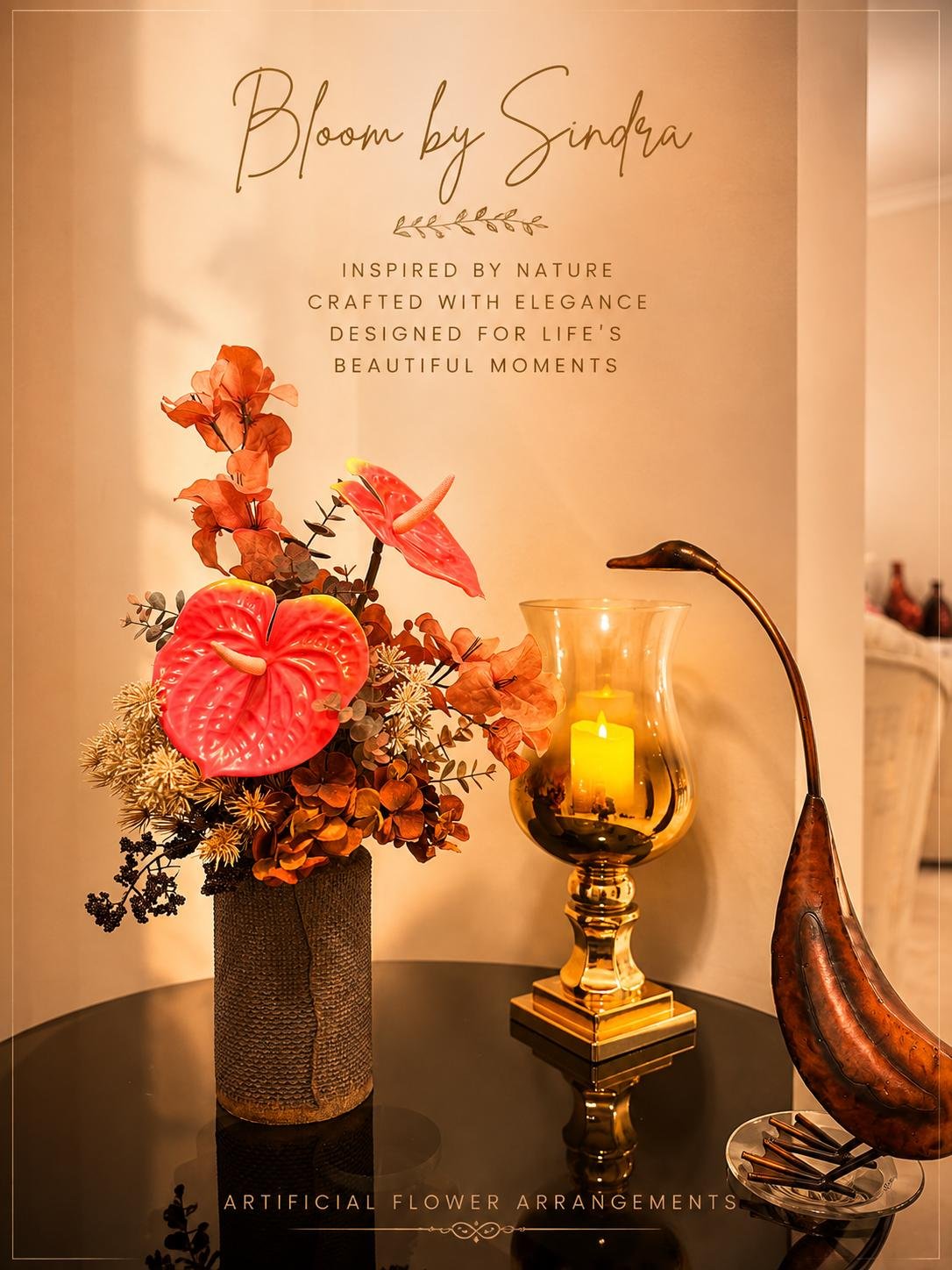 Bloom by Sindra branded photo of red anthurium and bougainvillea arrangement in a woven vase beside a bronze crane