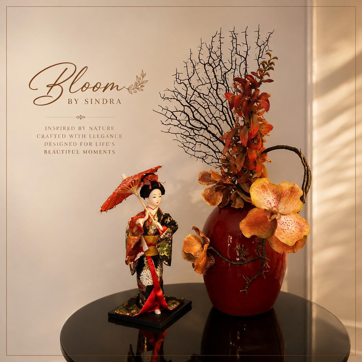 Bloom by Sindra branded photo of a red vase orchid arrangement beside a traditional geisha figurine