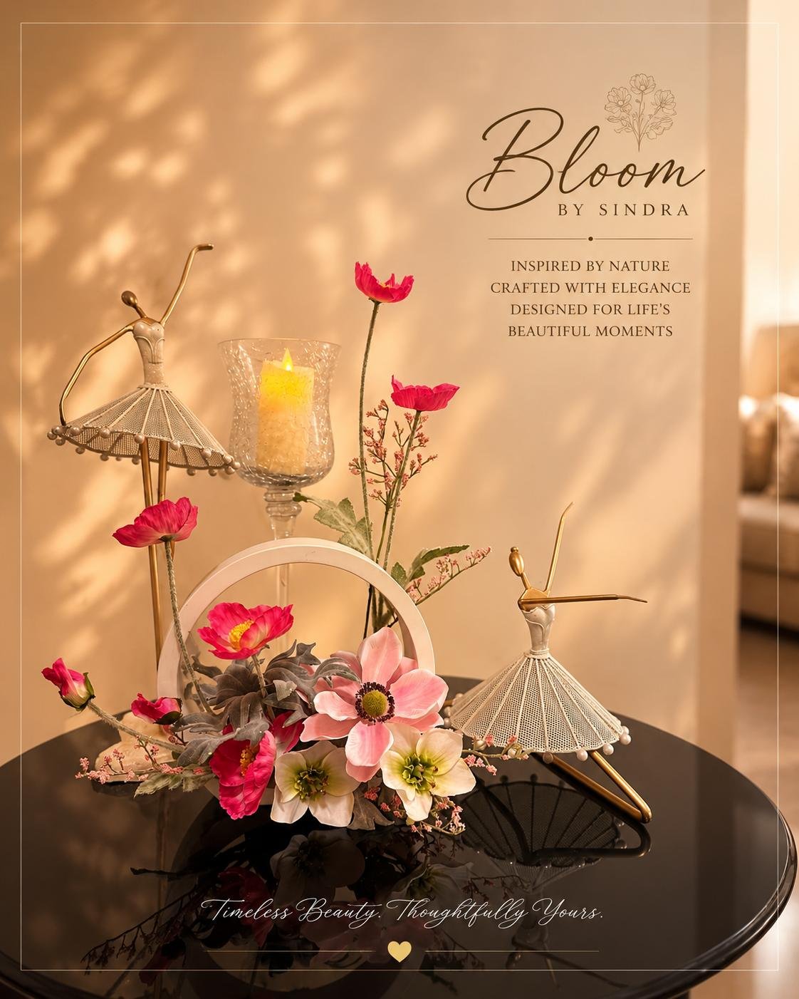 Bloom by Sindra branded photo of pink poppies and anemones arranged with a decorative ring and ballerina figurines